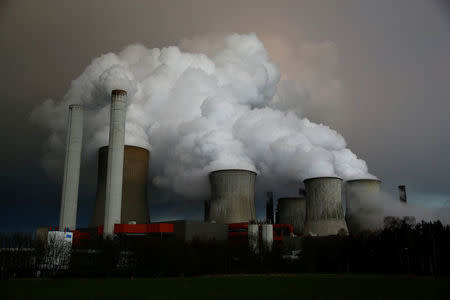 FILE PHOTO: Steam rises from the cooling towers of the coal power plant of RWE, one of Europe's biggest electricity and gas companies in Niederaussem, north-west of Cologne, Germany March 3, 2016. REUTERS/Wolfgang Rattay/File Photo