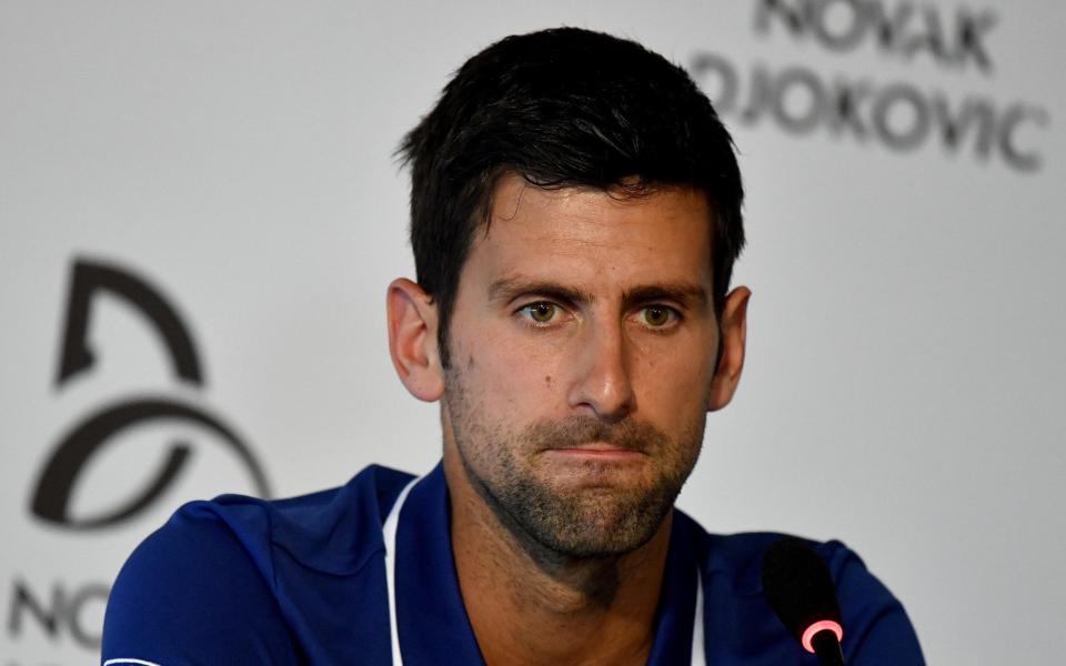 Novak Djokovic speaks during a news conference in Belgrade - Credit: Andrej Isakovic/Reuters