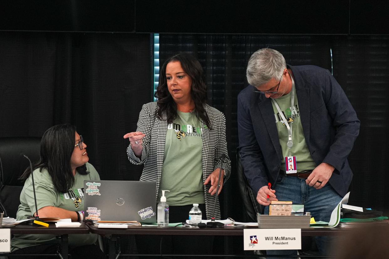 Hays CISD board of trustees members wear "Tom Green Strong," shirts at a Hays Consolidated Independent School District Board of Trustees special meeting on the district's school bus seat belt plan at the Historic Buda Elementary Campus on Monday, April 15, 2024 in Buda, Texas. Two died and dozens were injured on March 22, 2024 when a commercial concrete truck struck a Hays CISD school bus in Bastrop County.