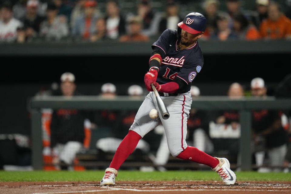 Washington Nationals' Ildemaro Vargas swings at a pitch from the Baltimore Orioles during the second inning of a baseball game, Tuesday, Sept. 26, 2023, in Baltimore. (AP Photo/Julio Cortez)