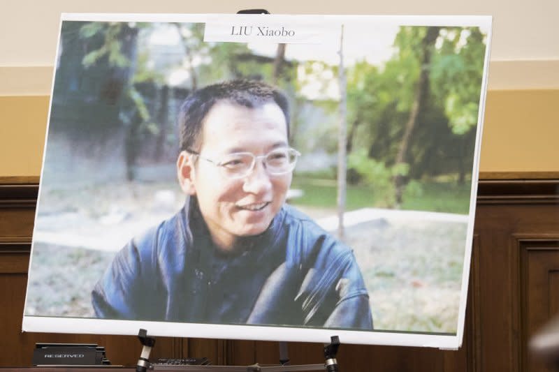 On December 10, 2010, Chinese dissident and Nobel Peace Prize winner Liu Xiaobo, represented by a portrait and an empty chair, was honored during the Nobel presentations in Oslo, Norway. Liu was in a northeastern China prison serving an 11-year sentence for subversion and his family was forbidden from attending the ceremony. He is pictured here, after his death, in a photo during a House Foreign Affairs subcommittee meeting in 2017. File Photo by Kevin Dietsch/UPI