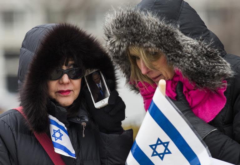 Supporters listen to Israeli Prime Minister Benjamin Netanyahu's address to a joint session of the US Congress in Washington, DC, on March 3, 2015