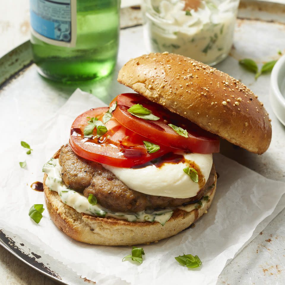 <p>If you're a fan of caprese salads, you'll love this healthy turkey burger recipe. The patties are seasoned with Italian spices, then topped with juicy tomatoes drizzled with balsamic, fresh basil and fresh mozzarella. We've doubled down on the basil in this recipe by mixing it into the mayo and using whole leaves to top the burger, but if you prefer less basil flavor, you can swap out the basil leaves for spinach or arugula. Serve this summery burger with a simple side salad for a healthy dinner that's full of fresh flavors.</p> <p> <a href="https://www.eatingwell.com/recipe/274357/caprese-turkey-burgers/" rel="nofollow noopener" target="_blank" data-ylk="slk:View Recipe;elm:context_link;itc:0;sec:content-canvas" class="link ">View Recipe</a></p>