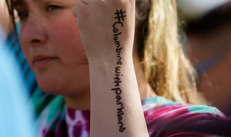 Columbine High School student Leah Zunder displays writing on her arm while participating in National School Walkout to honor the 17 students and staff members killed at Marjory Stoneman Douglas High School in Parkland, Florida, at Columbine in Littleton, Colorado, U.S. March 14, 2018. REUTERS/Rick Wilking