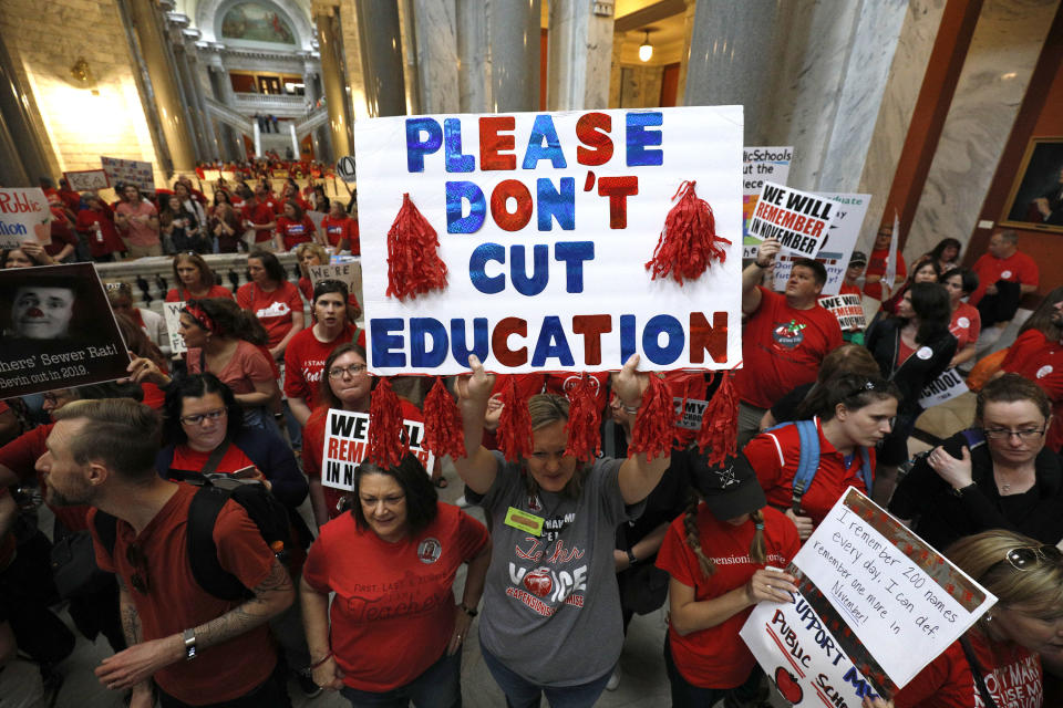 <p>Kentucky Public school teachers protest outside the Kentucky House Chamber as they rally for a “day of action” at the Kentucky State Capitol to try to pressure legislators to override Kentucky Governor Matt Bevin’s recent veto of the state’s tax and budget bills in Frankfort, Ky., April 13, 2018. (Photo: Bill Pugliano/Getty Images) </p>