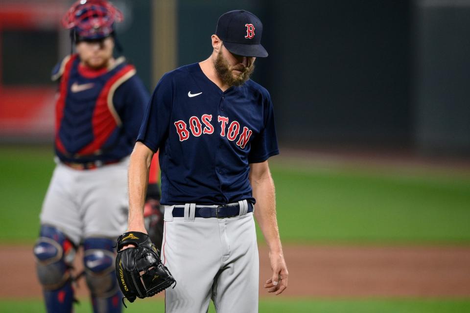 Red Sox starting pitcher Chris Sale walks back to the dugout after he was pulled during the sixth inning against the Orioles.
