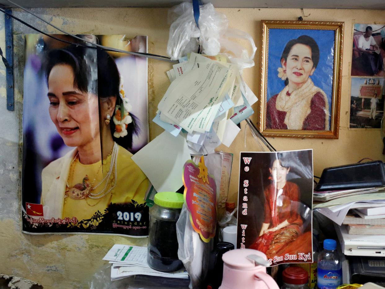 FILE PHOTO: Photographs of Myanmar State Counselor Aung San Suu Kyi hung in a shop in Yangon, Myanmar, January 23, 2020. REUTERS/Ann Wang