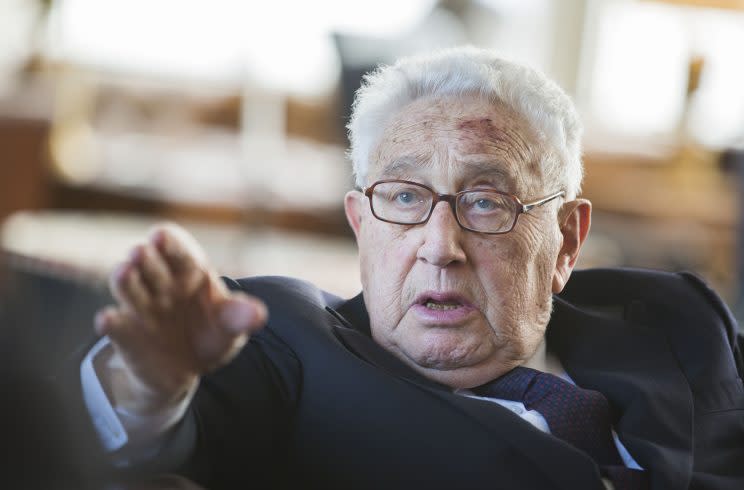 Former US Secretary of State Henry Kissinger gestures during a birthday reception for his 90th birthday in Berlin, Germany, June 11, 2013. The reception was held by German multimedia company Axel Springer AG. Kissinger was born May 27, 1923. (AP Photo/Gero Breloer)