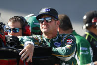 Clint Bowyer watches qualifying for the NASCAR Cup Series auto race at Michigan International Speedway in Brooklyn, Mich., Friday, Aug. 9, 2019. (AP Photo/Paul Sancya)