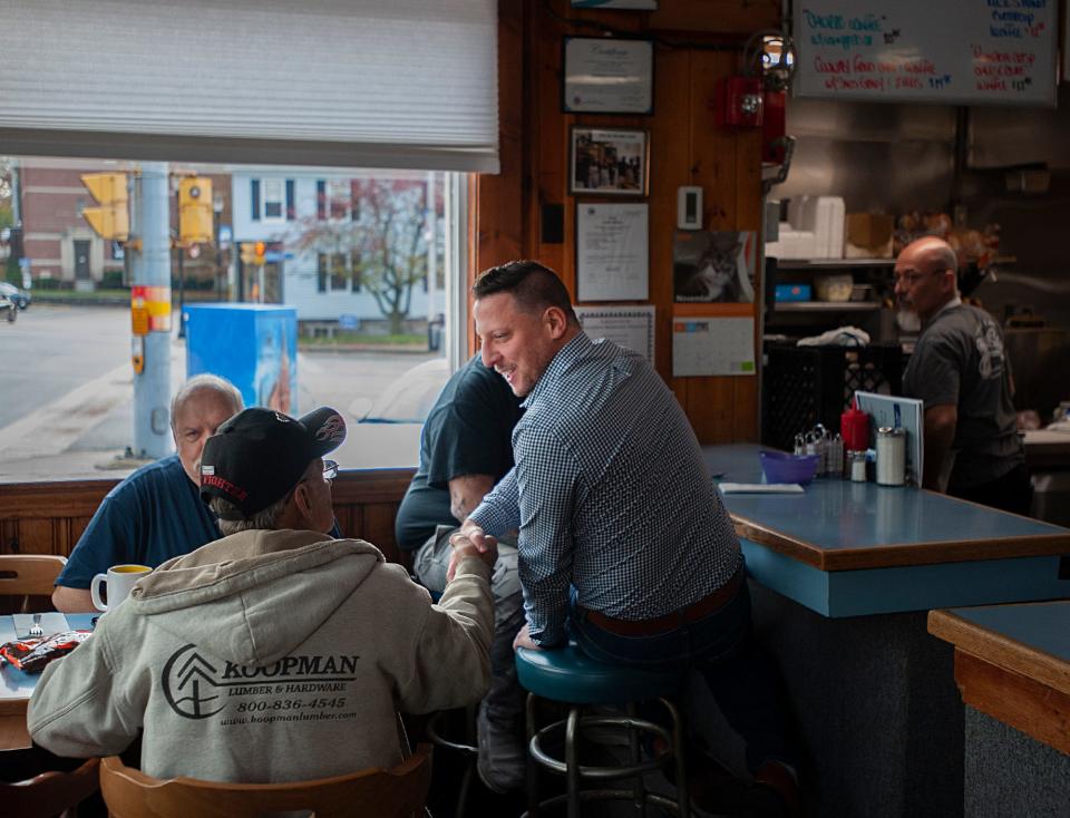 J. Christian Dumais greets diners inside Jake's Restaurant and Coffee Shop on Election Day, Nov. 7, 2023. Marlborough voters elected Dumais to become the city's next mayor.