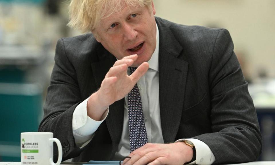 Boris Johnson chats with teachers during a visit to Kirklees College in Dewsbury, West Yorkshire.