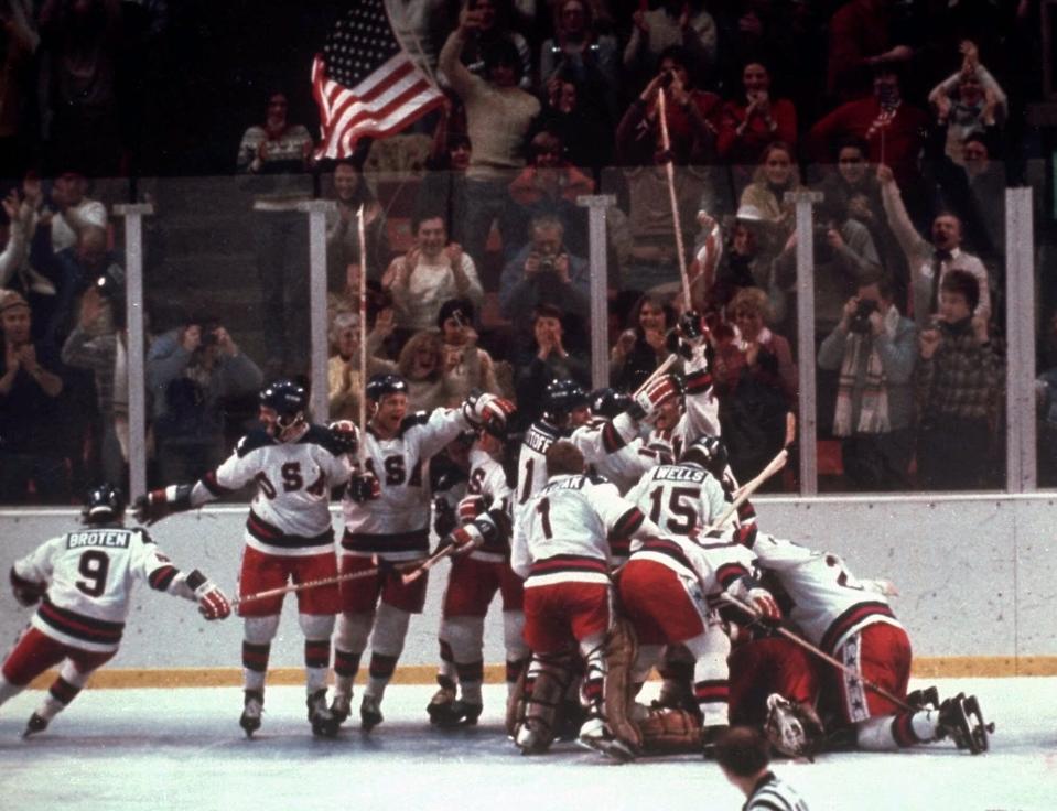 FILE - In this Feb. 22, 1980, file photo, the U.S. hockey team pounces on goalie Jim Craig after a 4-3 victory against the Soviet Union in a medal round match at the the 1980 Winter Olympics in Lake Placid, N.Y. The United States upset the mighty Soviets in a breathtaking moment freighted with the tension of the Cold War. After four decades, nobody is willing to stop talking about perhaps the greatest David over Goliath moment in the history of sports. (AP Photo/File)