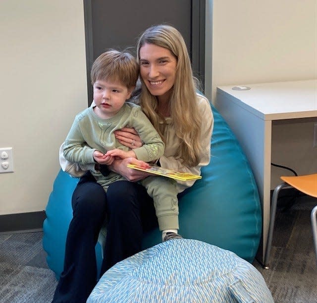 Woodbridge resident Kristin Markowski of the Colonia section and her 2-year-old son Blake in the children's section of the newly renovated Henry Inman Branch Library in Woodbridge
