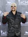 Celebrity chef Guy Fieri arrives at the 49th Annual Academy of Country Music Awards in Las Vegas, Nevada April 6, 2014. REUTERS/Steve Marcus (UNITED STATES - Tags: ENTERTAINMENT) (ACMAWARDS-ARRIVALS)