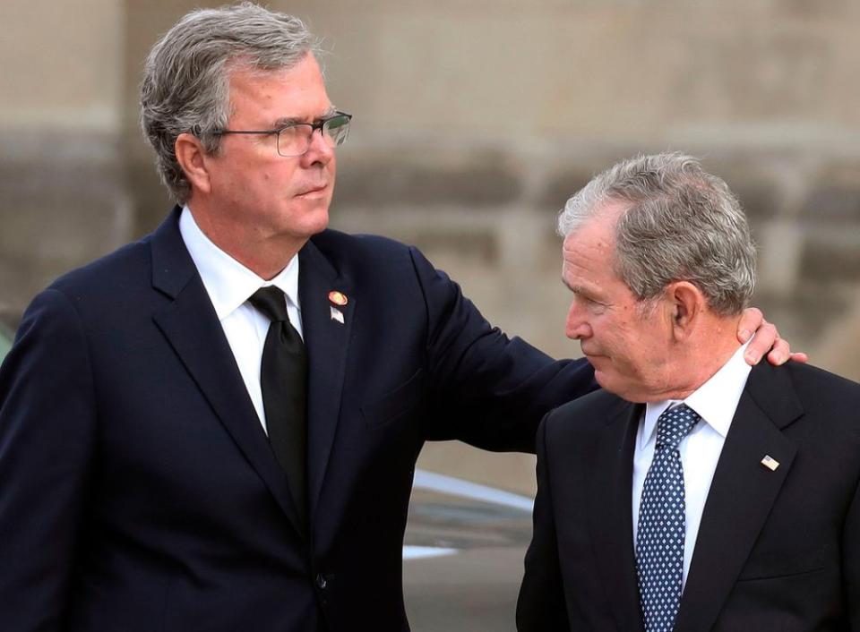 Jeb Bush (left) with former President George W. Bush | ALEX EDELMAN/AFP/Getty