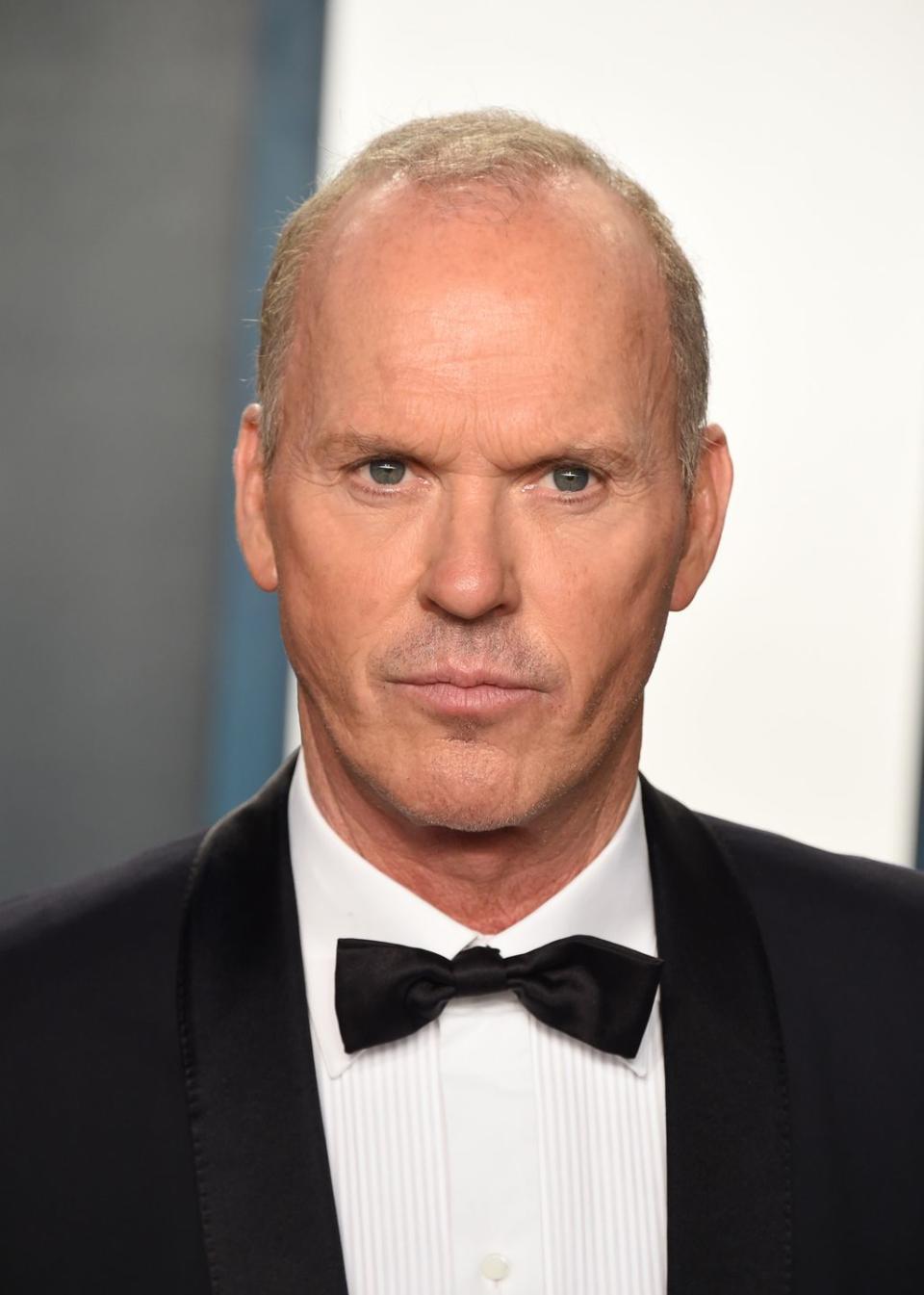 Michael Keaton (head that's mostly bare)