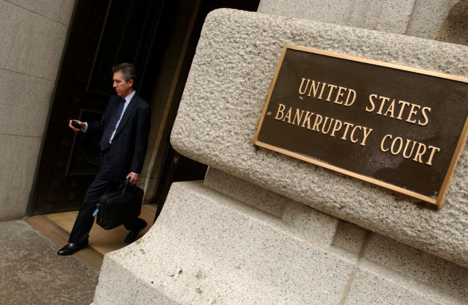 An unidentified man exits the United States Bankruptcy Court in Lower Manhattan in New York City. (Photo by Ramin Talaie/Corbis via Getty Images)