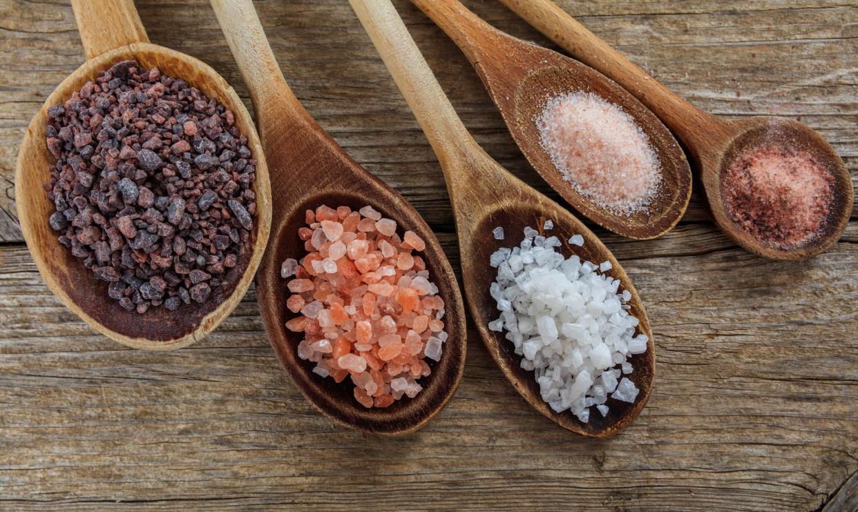 Variety of salts in wooden spoons