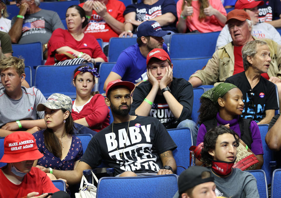 TULSA, OKLAHOMA - JUNE 20: Supporters wait for the start of a campaign rally for U.S. President Donald Trump at the BOK Center, June 20, 2020 in Tulsa, Oklahoma. Trump is holding his first political rally since the start of the coronavirus pandemic at the BOK Center on Saturday while infection rates in the state of Oklahoma continue to rise. (Photo by Win McNamee/Getty Images)