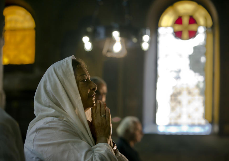 <p>An Egyptian Coptic Christian prays during a service for the departed remembering the victims of EgyptAir flight 804, at Al-Boutrossiya Church, the main Coptic Cathedral complex in Cairo, Egypt, May 22, 2016. The Airbus A320 plane was flying from Paris to Cairo with 66 passengers and crew when it disappeared early last Thursday over the Mediterranean Sea. (Amr Nabil/AP) </p>