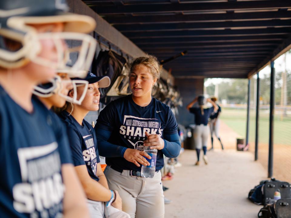 Aubrey Hutzler, a catcher with the Nova Southeastern University softball team, has endured POTS for five years. (Martina Tuaty for The Washington Post)