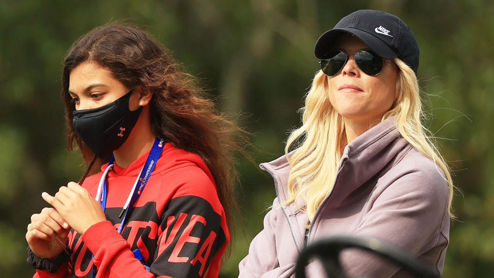 Pictured here, Sam Woods and Tiger's ex-wife Elin Nordegren watch the tournament unfold.