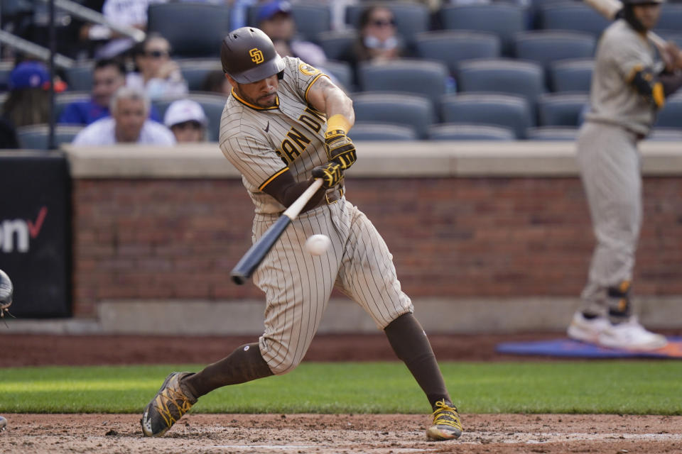 San Diego Padres' Tommy Pham hits a single during the sixth inning of a baseball game against the New York Mets, Saturday, June 12, 2021, in New York. (AP Photo/Frank Franklin II)