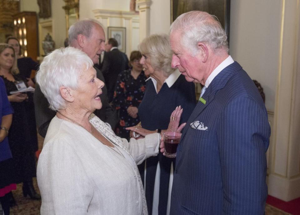 Charles chats to Dame Judi Dench during his wife’s event (Ian Jones/PA) (PA Wire)