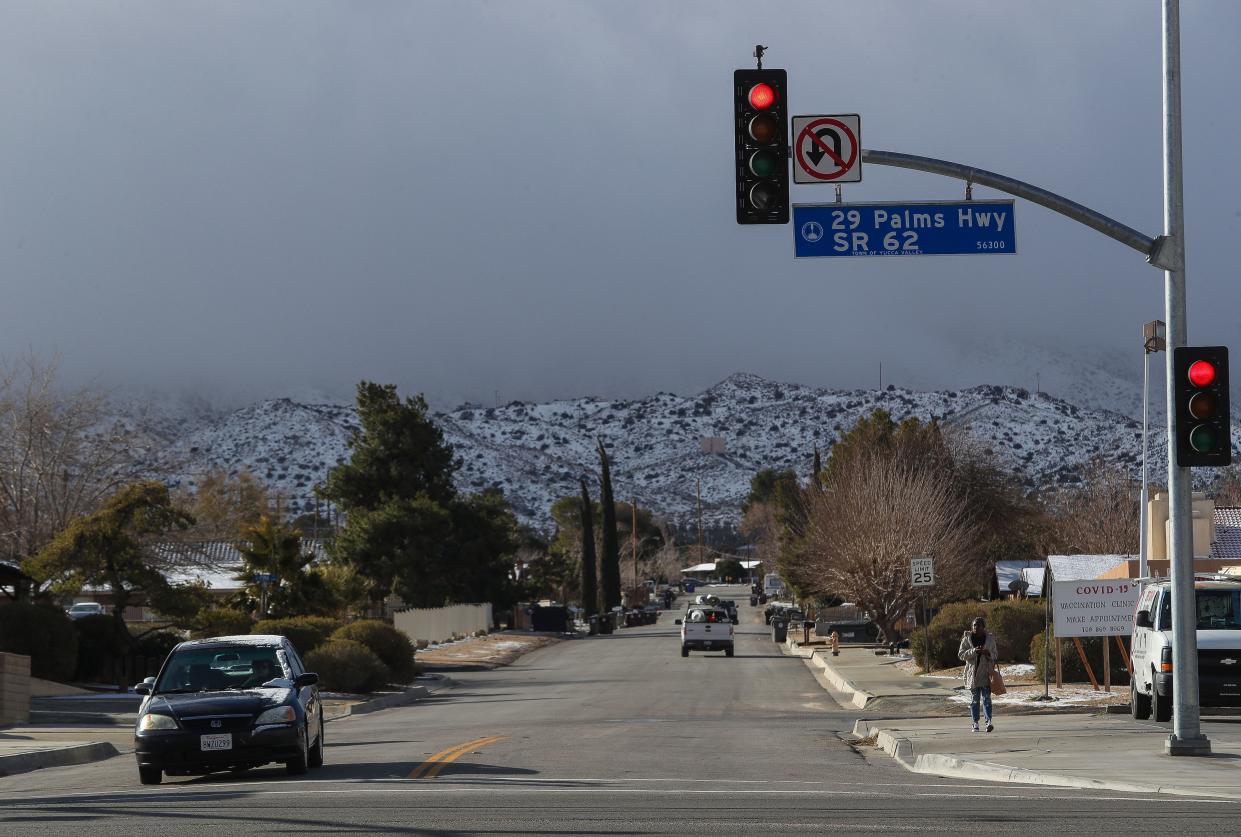 A light dusting of snow in covers the hillsides in Yucca Valley, Calif., Feb. 23, 2023. 