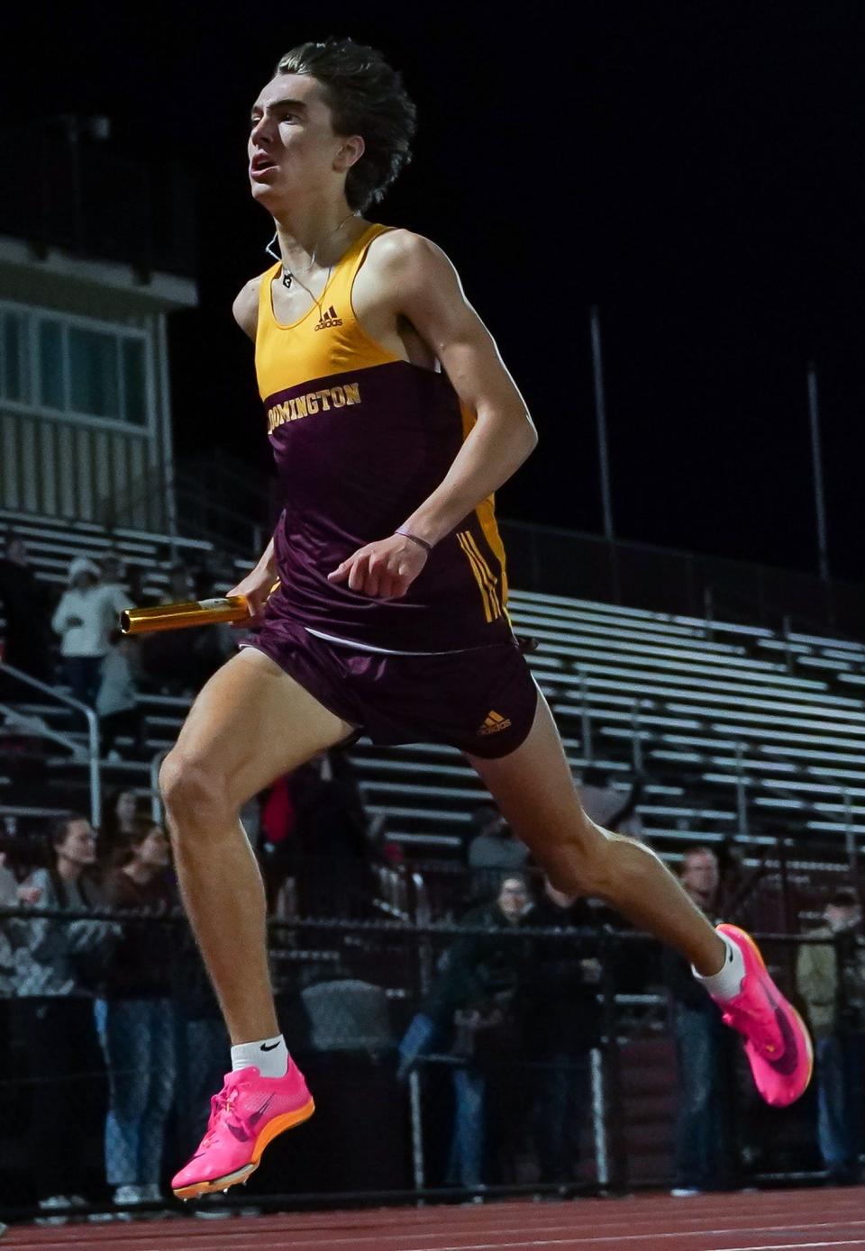 Bloomington North’s Caleb Winders crosses the finish line in the boys' 1,600-meter relay during the Conference Indiana track meet at Bloomington North on Friday, April 26, 2024.