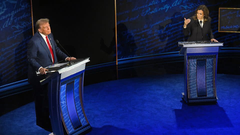 Vice President and Democratic presidential candidate Kamala Harris speaks as former President and Republican presidential candidate Donald Trump listens during a presidential debate at the National Constitution Center in Philadelphia, Pennsylvania, on September 10, 2024. - Saul Loeb/AFP/Getty Images