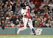 Boston Red Sox catcher Connor Wong (12) hits the ball for an RBI during the seventh inning of a baseball game against the San Francisco Giants, Wednesday, May 1, 2024, in Boston. (AP Photo/Mark Stockwell)