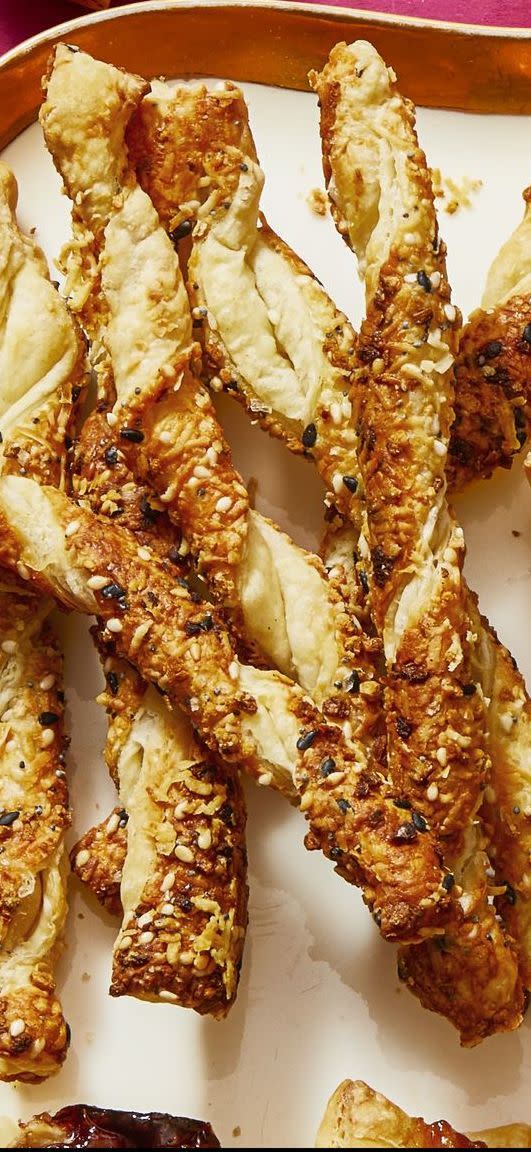 <p>Add grated cheese and everything bagel seasoning into puff pastry — then watch your guests devour this irresistible snack in <em>seconds</em>. </p><p>Get the <a href="https://www.goodhousekeeping.com/food-recipes/a30381345/buffalo-glazed-chicken-two-ways-recipe/" rel="nofollow noopener" target="_blank" data-ylk="slk:Pecorino-Everything Spice Straws recipe;elm:context_link;itc:0;sec:content-canvas" class="link "><strong>Pecorino-Everything Spice Straws recipe</strong></a>. </p>