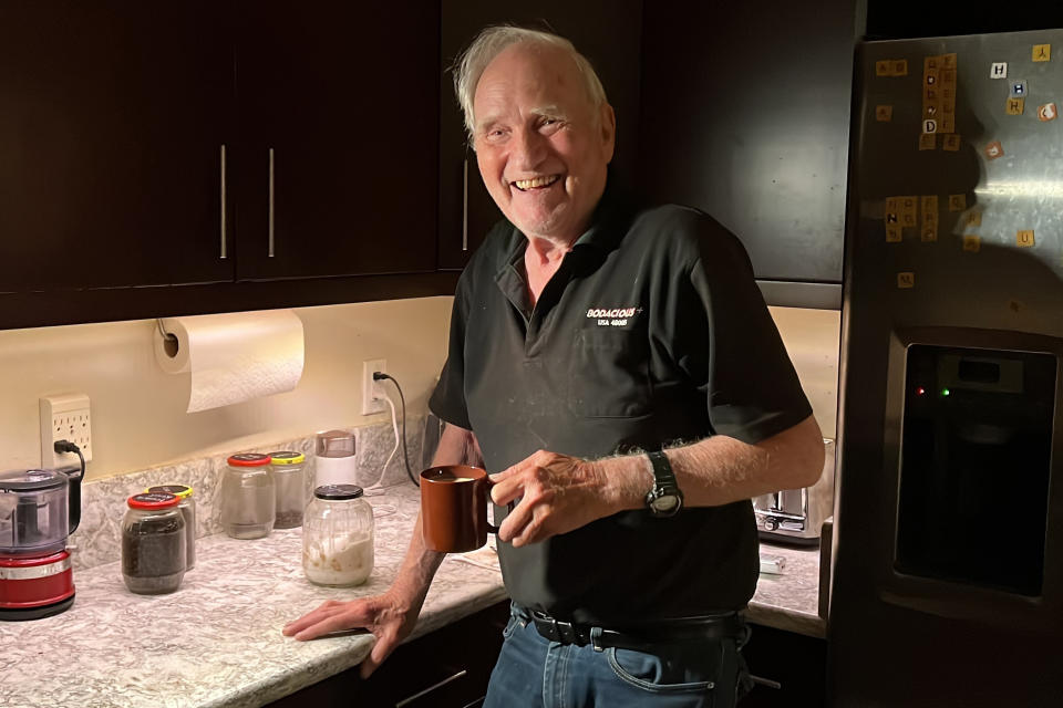 John F. Clauser stands in his kitchen at his home in Walnut Creek, Calif., on Tuesday, Oct. 4, 2022. Clauser, Alain Aspect of France, and Anton Zeilinger of Austria were cited by the Royal Swedish Academy of Sciences for discovering the way that particles known as photons can be linked, or “entangled,” with each other even when they are separated by large distances. (AP Photo/Terry Chea)