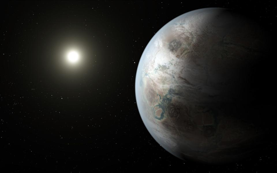 This artist rendering depicts one possible appearance of the planet Kepler-452b, the first near-Earth-size world to be found - Credit: AP