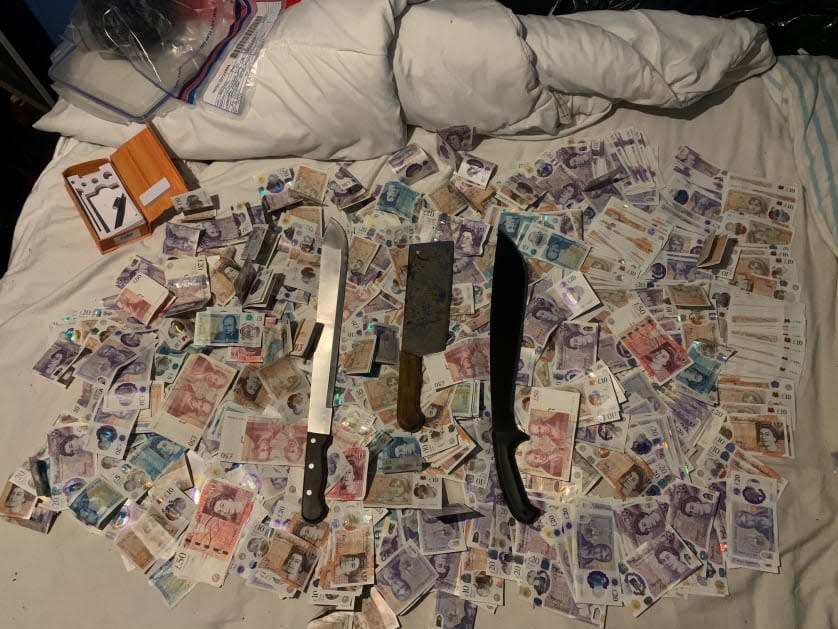 <p>Cash and weapons recovered in county lines drug busts</p> (Met police )