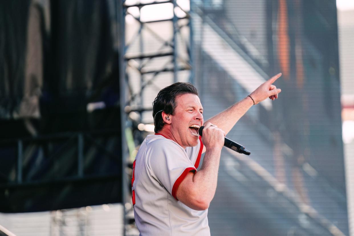 Clayton Anderson hypes up the crowd on stage at The Full Ride Tour concert in Indiana University Memorial Stadium on Saturday, April 13, 2024.