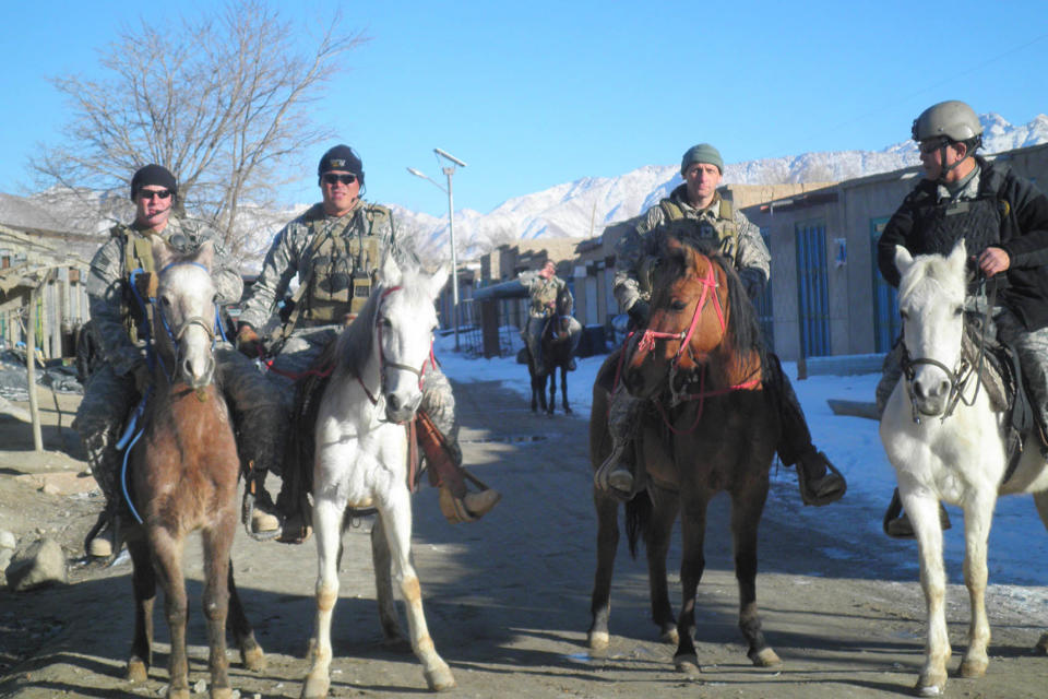 Col. Donald Bolduc, Combined Joint Special Operations Task Force-Afghanistan commander, with members of a U.S. Special Forces Operational Detachment - Alpha, assigned to Special Operations Task Force - Southeast, patrol through a village Jan. 16, 2011, in Khas Uruzgan District, Uruzgan Province, Afghanistan. Over the last 12 months, U.S. Special Forces teams operating in the area have worked with the Afghan population and elements of the Afghan National Security Forces to improve security and governance in the area.