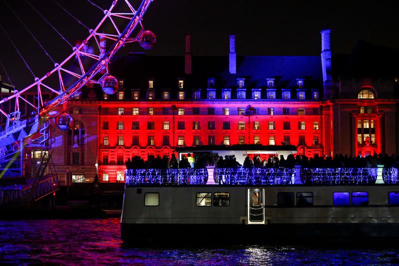 A party boat sails past the London Eye ahead of New Year celebrations in central London