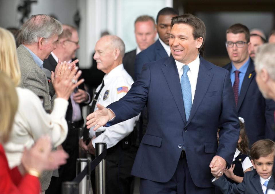 Florida Gov. Ron DeSantis greets supporters.