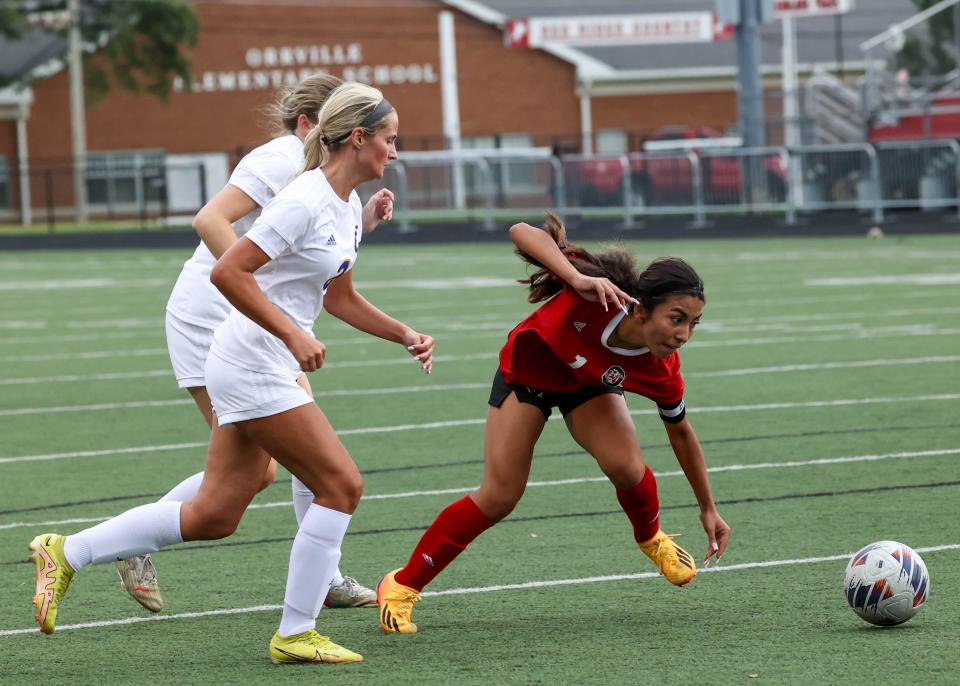 There is no slowing down Valerie Gonzalez-Quinteros as she rights herself after being tripped from behind to continue a run here in the first half.