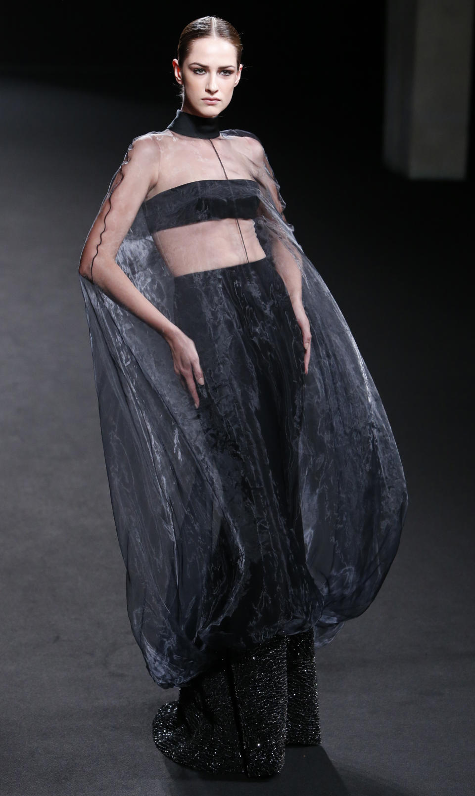 A model wears a creation by French fashion Stephane Rolland's Haute Couture Fall-Winter 2013-2014 collection presented Tuesday, July 2, 2013 in Paris. (AP Photo/Francois Mori)