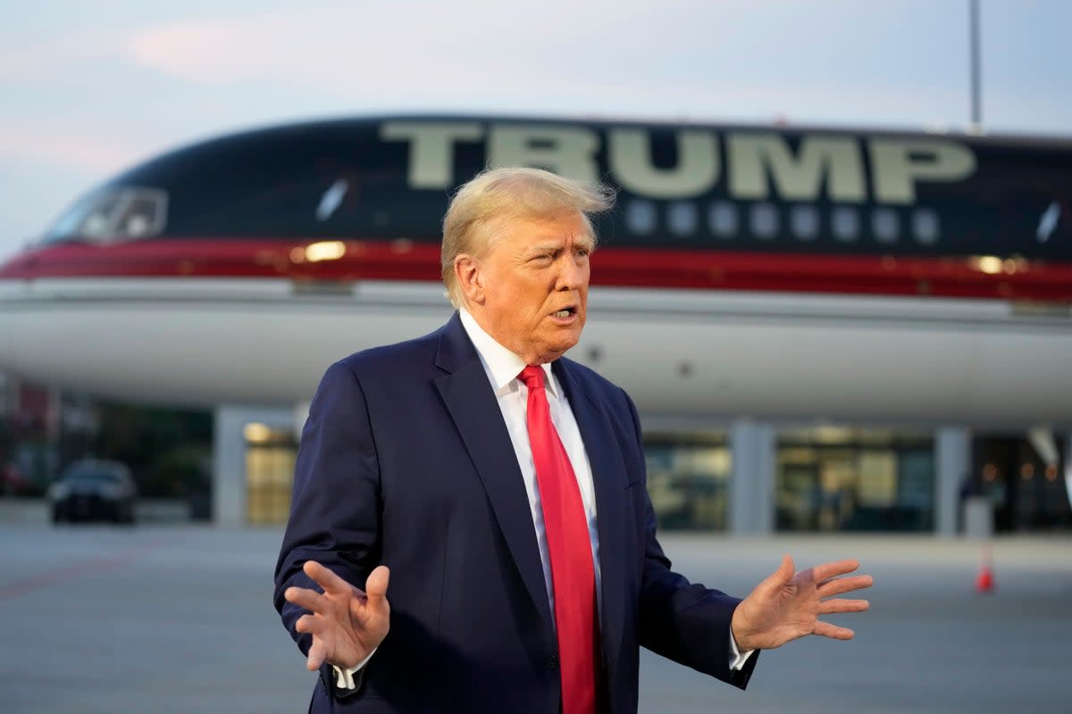 Trump addresses gathered media  (AP)