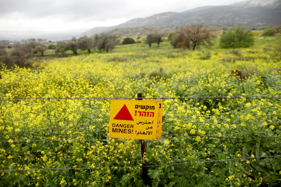 A sign warning of landmines is seen on a fence in the Golan Heights, the territory that Israel captured from Syria and occupied in the 1967 Middle East war, February 27, 2019. Many Israeli and foreign tourists drive past the site on their way to popular holiday spots.  (Photo: Ronen Zvulun/Reuters)