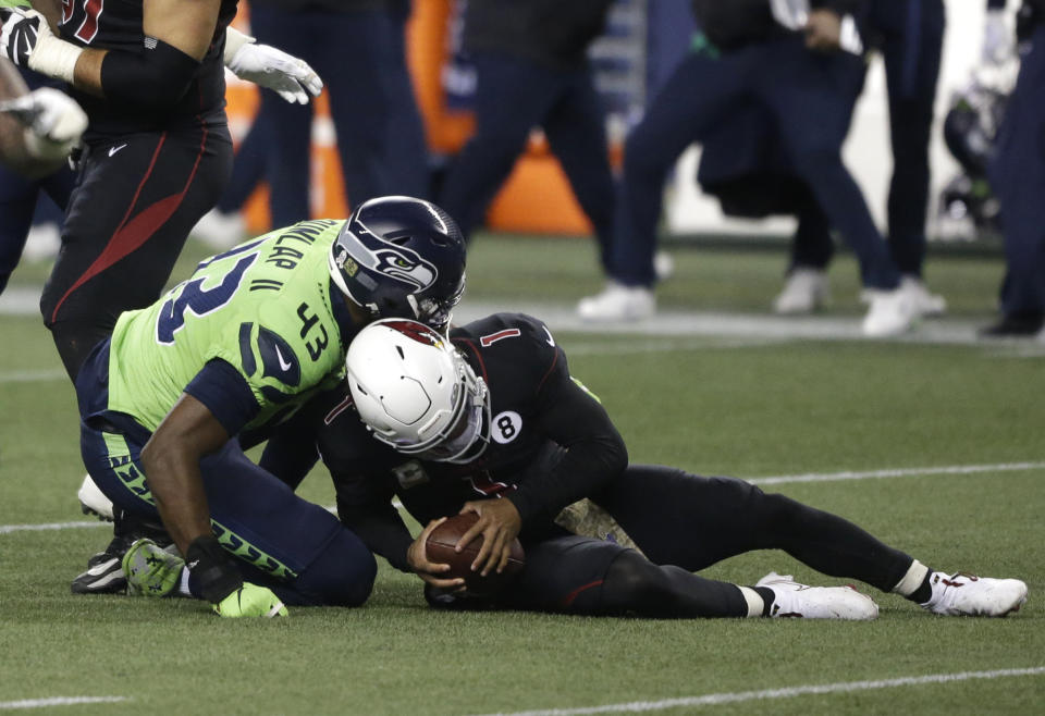 Seattle Seahawks defensive end Carlos Dunlap (43) sacks Arizona Cardinals quarterback Kyler Murray (1), late in the second half of an NFL football game, Thursday, Nov. 19, 2020, in Seattle. The Seahawks won 28-21. (AP Photo/Lindsey Wasson)