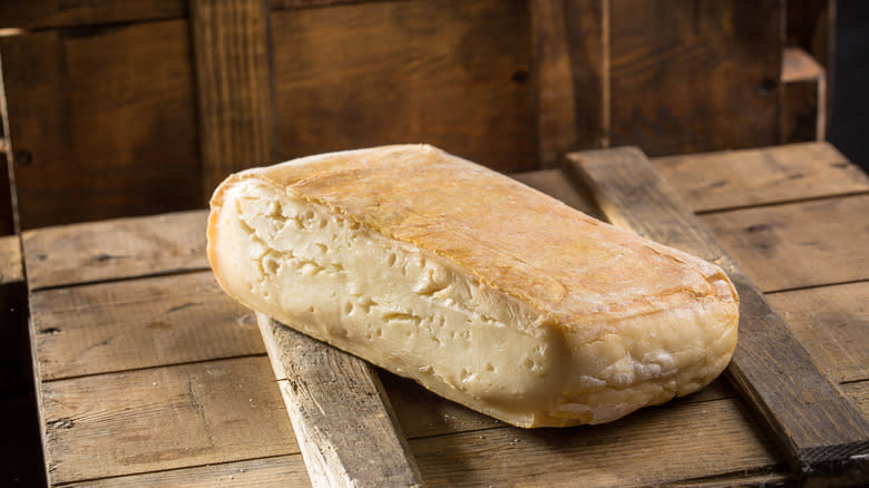 Taleggio cheese on wood