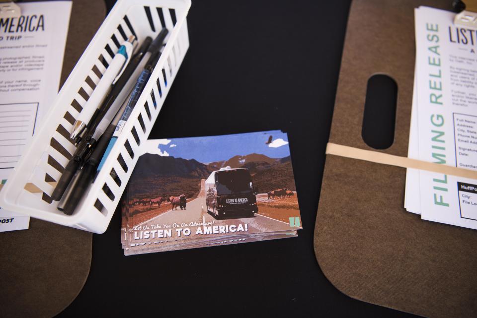 A table with postcards&nbsp;sits at the HuffPost video activation site.