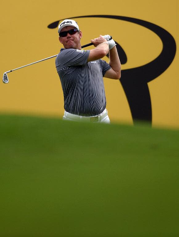 Lee Westwood tees off on the fourteenth hole during the second round of the Maybank Malaysian Open in Kuala Lumpur on April 18, 2014