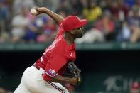 Texas Rangers relief pitcher Taylor Hearn throws to a Seattle Mariners batter during the second inning of a baseball game in Arlington, Texas, Friday, Aug. 12, 2022. (AP Photo/Tony Gutierrez)