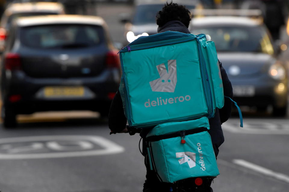 A Deliveroo delivery rider cycles in London, Britain, March 8, 2021. REUTERS/Toby Melville